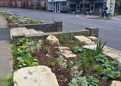 Improved planting at the stepped entrance from Station Road