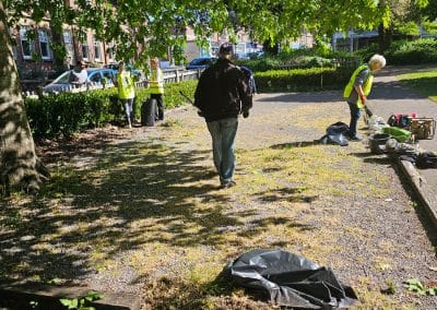 Volunteers from Parkstone Rotary Club weed the first of the pétanque terrains